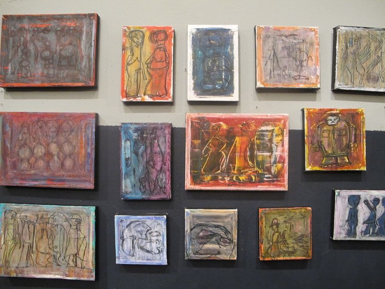 A wall of original works at the RAM Gallery